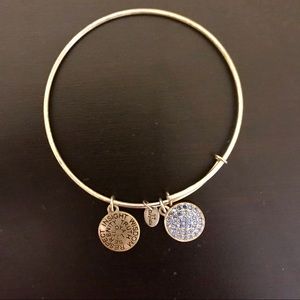 Gold bracelet with blue charms